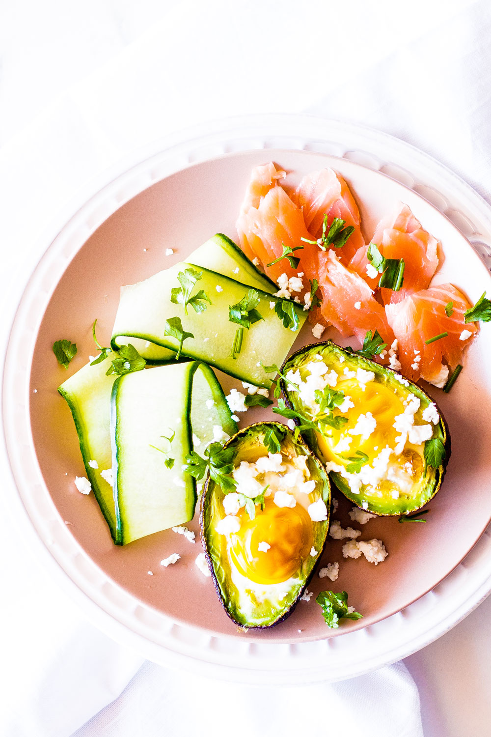 Baked avocado boats with eggs and smoked salmon are a match made in brunch heaven! Not only is this recipe healthy, but it is also gluten-free, high in protein, and low in carbohydrates. https://www.spotebi.com/recipes/baked-avocado-boats-eggs-smoked-salmon/