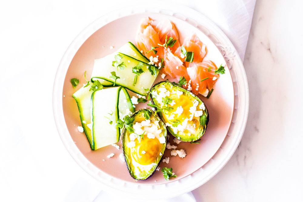 Baked avocado boats with eggs and smoked salmon are a match made in brunch heaven! Not only is this recipe healthy, but it is also gluten-free, high in protein, and low in carbohydrates. https://www.spotebi.com/recipes/baked-avocado-boats-eggs-smoked-salmon/