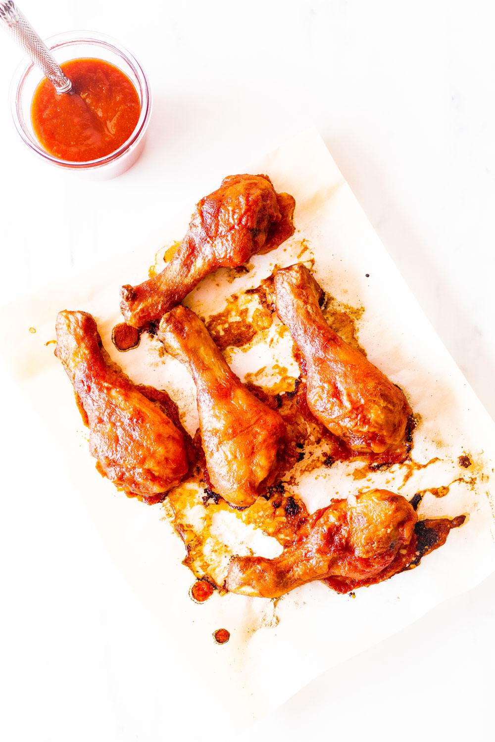 Perfect for your cookouts and backyard parties, these Caramelized Baked Barbecue Chicken Drumsticks are easy, flavorful and an instant crowd-pleaser you'll come back to all Spring and Summer long! https://www.spotebi.com/recipes/caramelized-baked-barbecue-chicken-drumsticks/