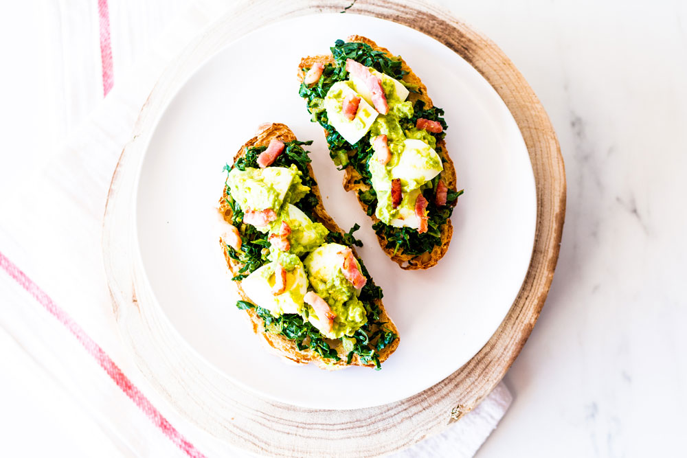 Toast is an ultra comforting food, and these yummy tostadas feature egg, bacon, avocado, and kale on crisp wholegrain toasts. https://www.spotebi.com/recipes/egg-bacon-avocado-tostadas/