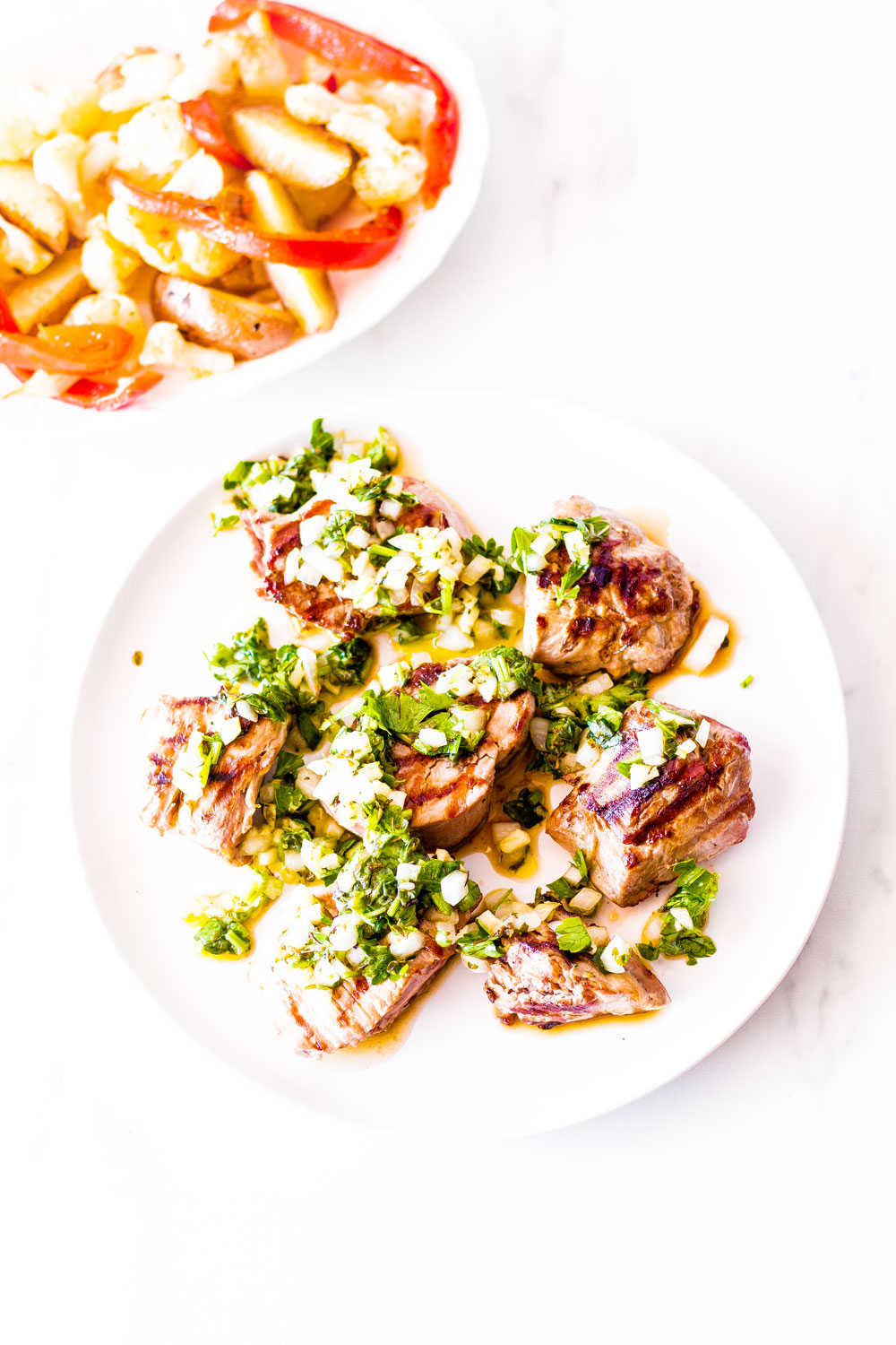 These Grilled Pork Medallions with Salsa Verde are an easy and delicious dish, perfect for summer entertaining! https://www.spotebi.com/recipes/grilled-pork-medallions-with-salsa-verde/