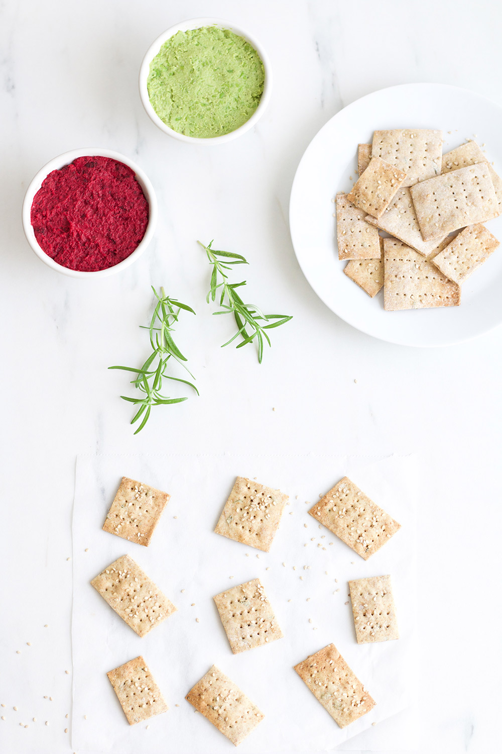 Rosemary Sesame Rice Crackers Recipe: Delicious crispy crackers as good as store-bought but made with a simple, feel-good list of ingredients. https://www.spotebi.com/recipes/rosemary-sesame-rice-crackers/