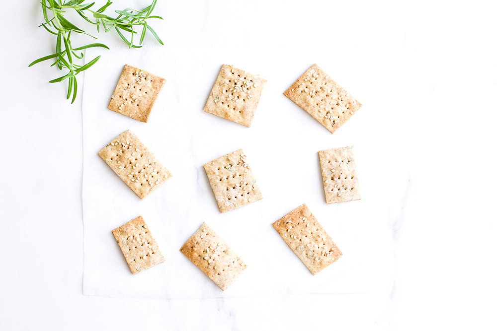 Rosemary Sesame Rice Crackers Recipe: Delicious crispy crackers as good as store-bought but made with a simple, feel-good list of ingredients. https://www.spotebi.com/recipes/rosemary-sesame-rice-crackers/